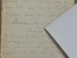 a piece of paper with writing on it next to a piece of paper with writing on it