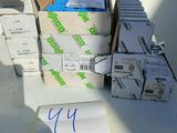 a pile of boxes of mail sitting on a table