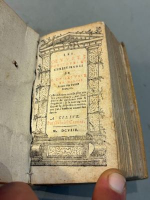 someone is holding a book open to a page with a picture on it