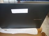 a laptop that is sitting in a box on the floor