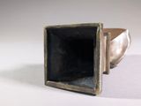 silver ring with a black stone in it on a white surface