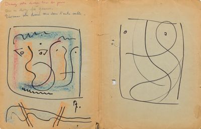 un vieux livre sur lequel figure le dessin d'un chat
