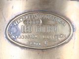 a close up of a brass plate with a name on it