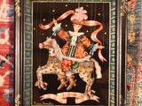a picture of a picture of a man riding a horse