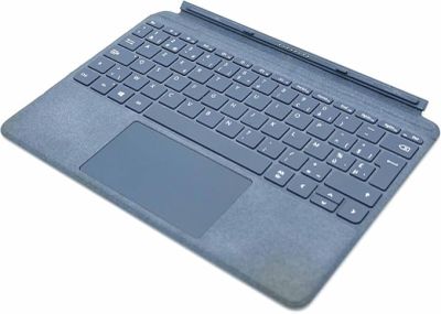 an open laptop computer sitting on top of a white surface