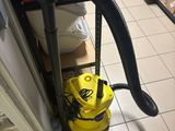 a vacuum that is sitting on the floor in the kitchen