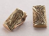 pair of gold tone filigree filigree beads