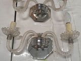 two glass sconces on a table with a price tag on it