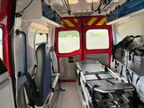 a view of an empty ambulance with its doors open