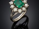 an emerald and diamond cluster ring
