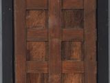 an old wooden door with a metal ring hanging from it ' s side