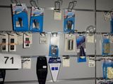 a display of cell phones and other electronics in a store