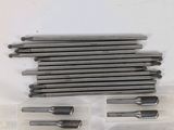 a bunch of screws in a plastic container on a white surface