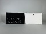 two black and white purses with chanel beauty written on them
