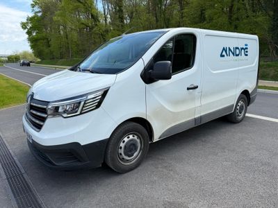 the van is parked on the side of the road in the parking lot