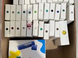 a box full of colored dominos sitting on the floor