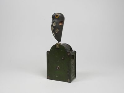 sculpture of an owl perched on top of a metal box