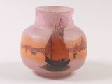a pink vase with a boat painted on it
