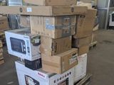 boxes stacked on top of each other on a cart in a warehouse