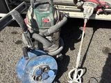an image of a vacuum and other tools on the ground