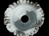 a white vase with a hole in the middle of it