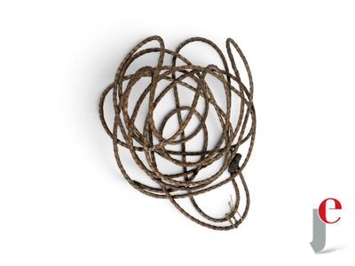a close up of a bunch of rope on a white surface