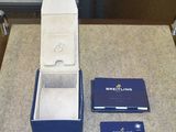 a box with a ring inside of it on a table