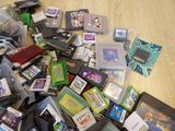 a pile of video games on the floor next to each other