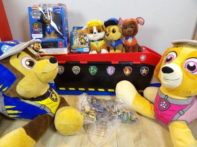 two stuffed animals sitting next to each other on a table