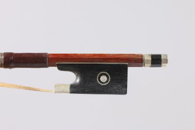 a violin bow with a wooden handle and a metal tip