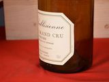 a bottle of wine that is sitting on a table