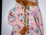 a picture of a pink jacket with a brown hoodie