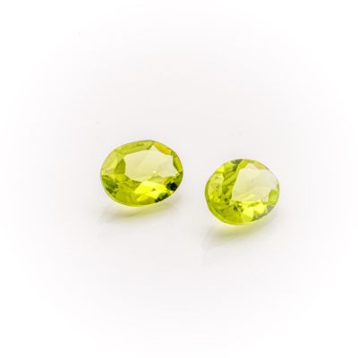 a pair of yellow sapphires on a white background