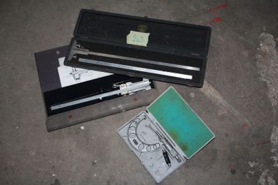 a broken laptop and other electronic equipment on the ground
