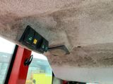a close up of a car dashboard with two switches