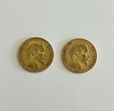 two gold sovereigns, one of which has a head of a man and the other of a woman