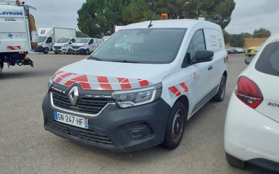 a white van with a red and white checkered design parked in a parking lot