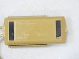 a yellow electronic device that is sitting on a table