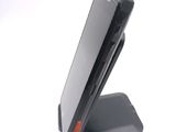 a cell phone that is sitting on top of a stand