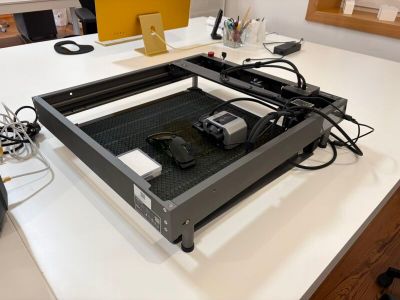 an image of a computer desk with a printer on top of it