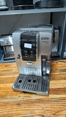 a coffee machine that is sitting on a wooden table