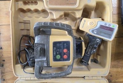 a tool in the case that is sitting on the floor