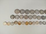 an image of a group of coins sitting on top of a white surface