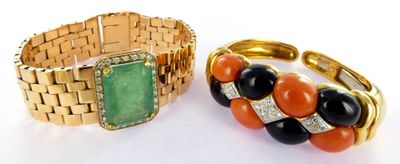 pair of gold bracelets with black, orange and green stones