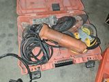 a tool box with tools on it sitting on the floor
