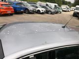 a lot of cars parked in a parking lot next to each other