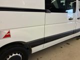 a white van that is parked in a garage
