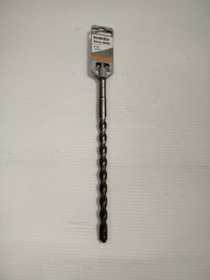 a close up of a drill on a white surface