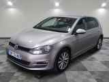 the silver volkswagen golf is parked on a checkered tile floor