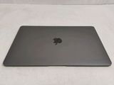 an apple macbook pro laptop computer sitting on top of a white surface